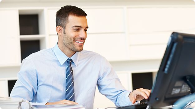 Man in front of a desktop