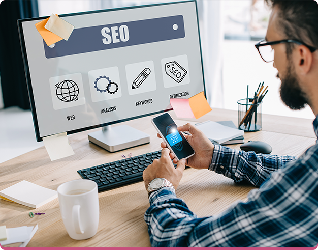 Man in front of a desktop with the SEO tab opened on it