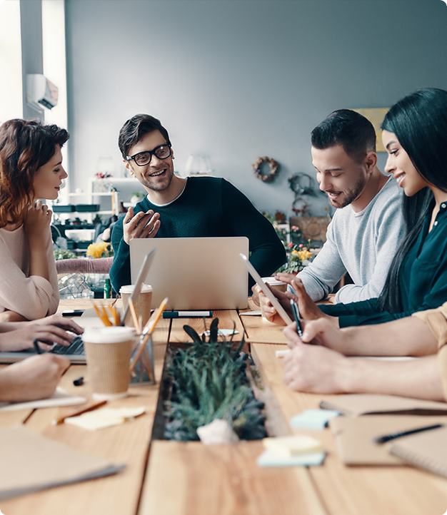 People in a meeting around a wooden table