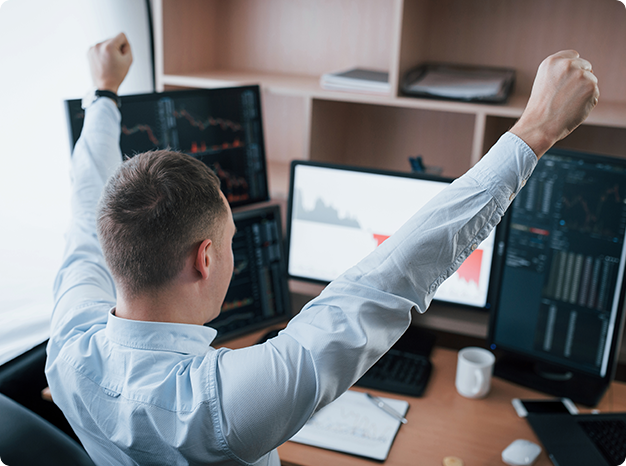 Man in front of a desktop with diagrams