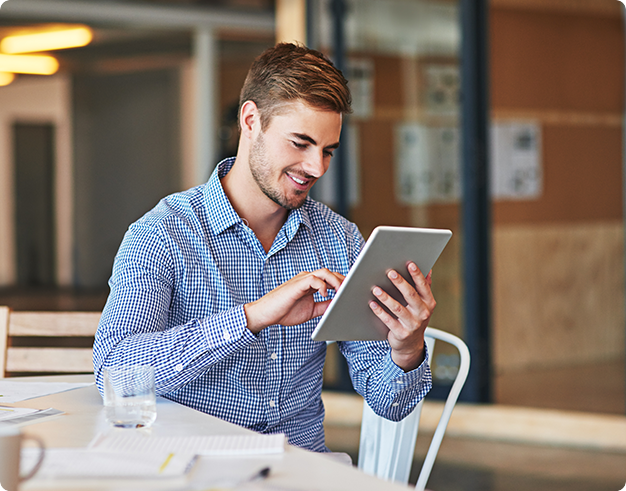 Man scrolling through his tablet