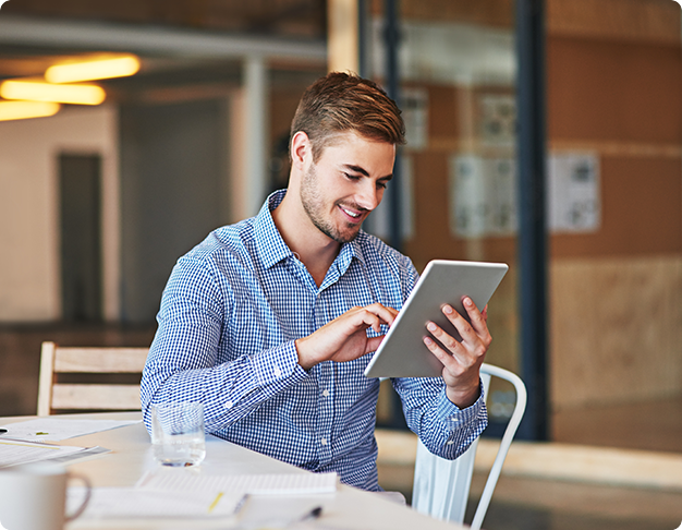 Man scrolling through his tablet